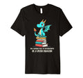Joyful Dragon Atop Books Encourages T-Shirt - Unique Graphic Unisex - T-Shirt, Sweatshirt, Hoodie
