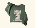 Bluey Being Mom Is Trifficult Shirt Bluey Mom Shirt Chilli Heeler Shirt Bluey Momlife Shirt Bluey Mama Shirt Bluey Family T-Shirts, Hoodie, Sweatshirt - T-Shirt, Sweatshirt, Hoodie