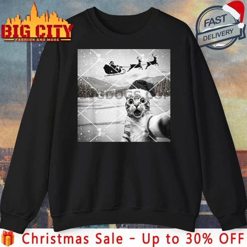 Cat Selfie with Santa Christmas 2025 meme shirt Unisex T-shirt, Sweatshirt, Hoodie, Long Sleeve Tee - T-Shirt, Sweatshirt, Hoodie