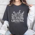 Growing Tiny Human Pregnancy Announcement Comfort Colors Shirt Spring Flower Baby Reveal Maternity Shirt Expecting T-Shirts, Hoodie, Sweatshirt - T-Shirt, Sweatshirt, Hoodie