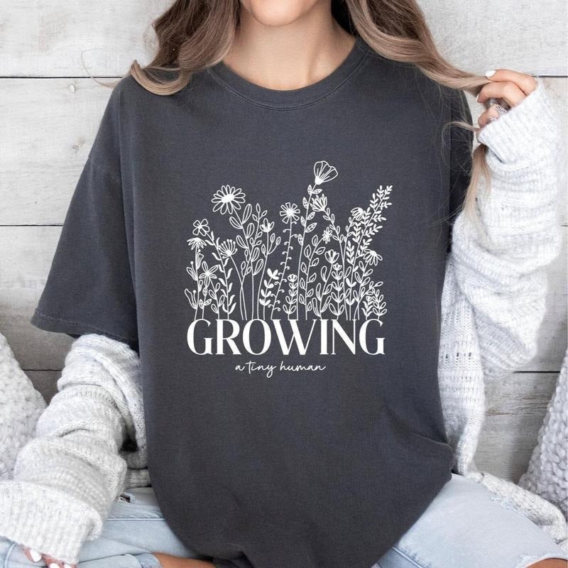 Growing Tiny Human Pregnancy Announcement Comfort Colors Shirt Spring Flower Baby Reveal Maternity Shirt Expecting T-Shirts, Hoodie, Sweatshirt - T-Shirt, Sweatshirt, Hoodie