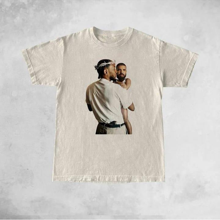 Kendrick Lamar Holding Baby Drake Shirt Kendrick Lamar Vs Drake Rap Beef Shirt Not Like Us Trending Shirt Funny Shirt T-Shirts, Hoodie, Sweatshirt - T-Shirt, Sweatshirt, Hoodie