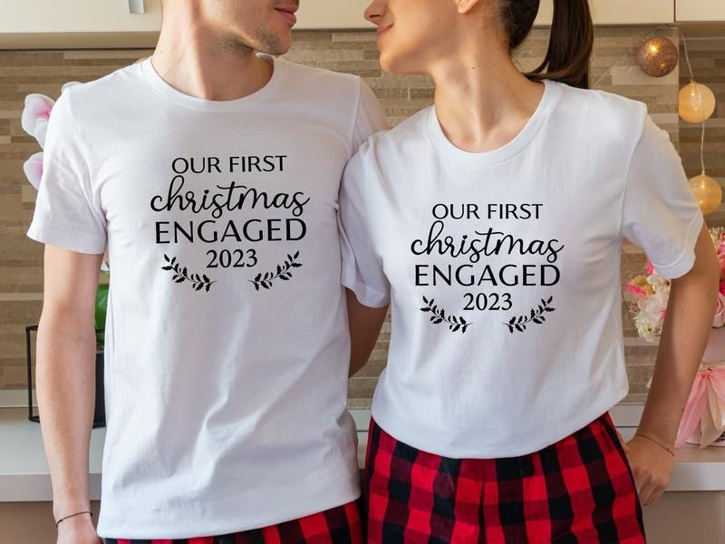 Our First Engaged 2023 Shirt Matching New Engaged Couple Xmas Engagement Fianc FiancE T-Shirts, Hoodie, Sweatshirt - T-Shirt, Sweatshirt, Hoodie