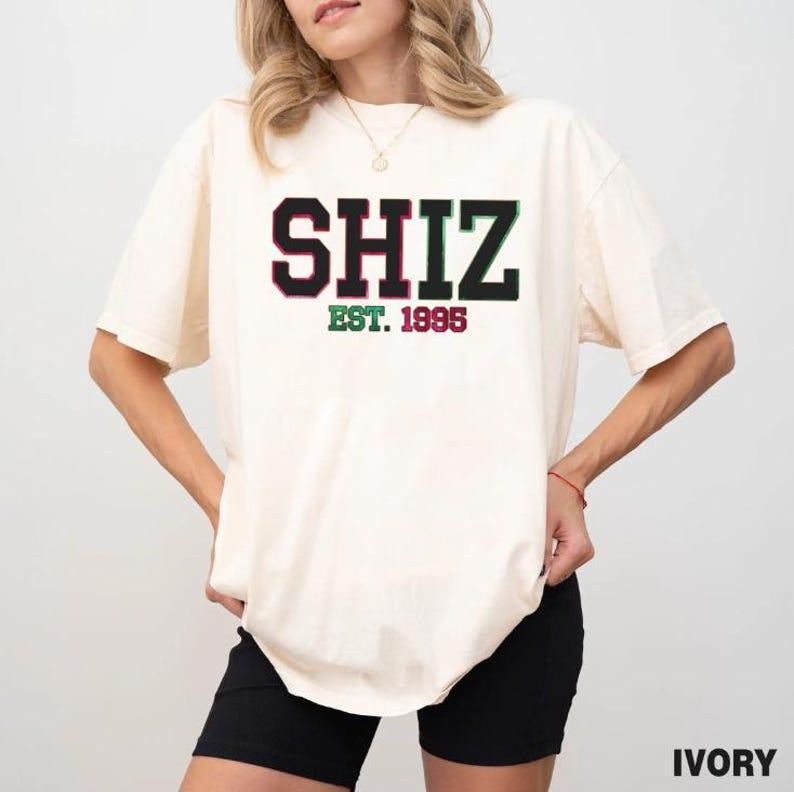 Shiz University Shirt Wickeds Movie Wizard Shiz University Shirt Defying Gravitiy Shirt Best Wickeds Movie T-Shirts, Hoodie, Sweatshirt - T-Shirt, Sweatshirt, Hoodie