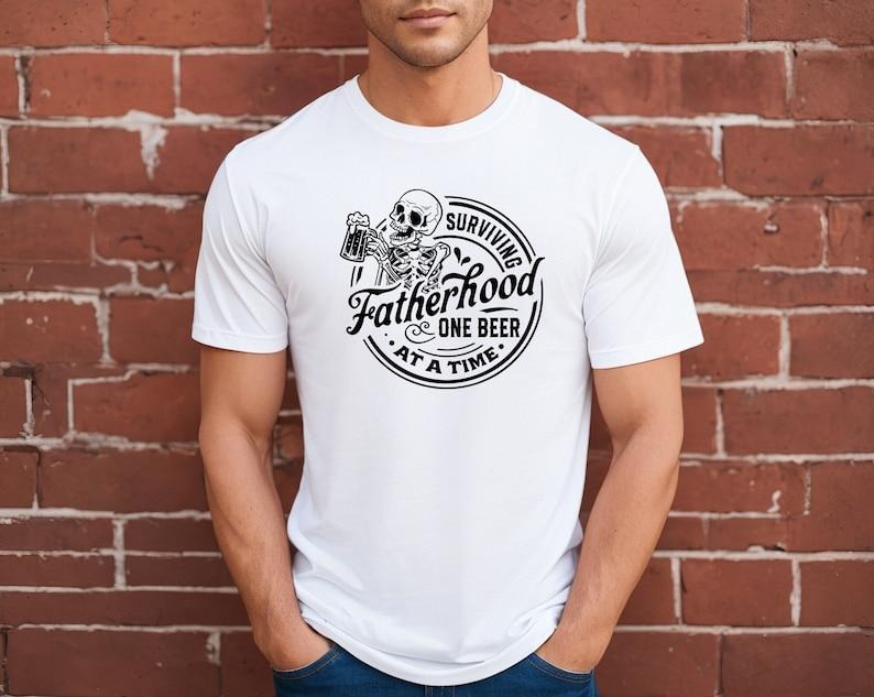 Surviving Fatherhood One Beer Time Shirt Funny Dad Shirt Dad Beer Lover Dad Shirt Dad Is Legend T-Shirts, Hoodie, Sweatshirt - T-Shirt, Sweatshirt, Hoodie