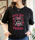 Cute But Feral Raccoon T-Shirt, Funny Raccoon Tee, Sassy Animal Shirt, Unisex T-shirt, Sweatshirt, Hoodie, Long Sleeve Tee - T-Shirt, Sweatshirt, Hoodie