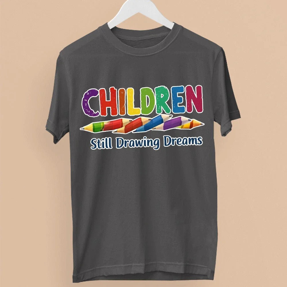 Children Still Drawing Dreams T-Shirt Teacher School Kids Creative Learning Gift Unisex T-shirt, Sweatshirt, Hoodie, Long Sleeve Tee - T-Shirt, Sweatshirt, Hoodie
