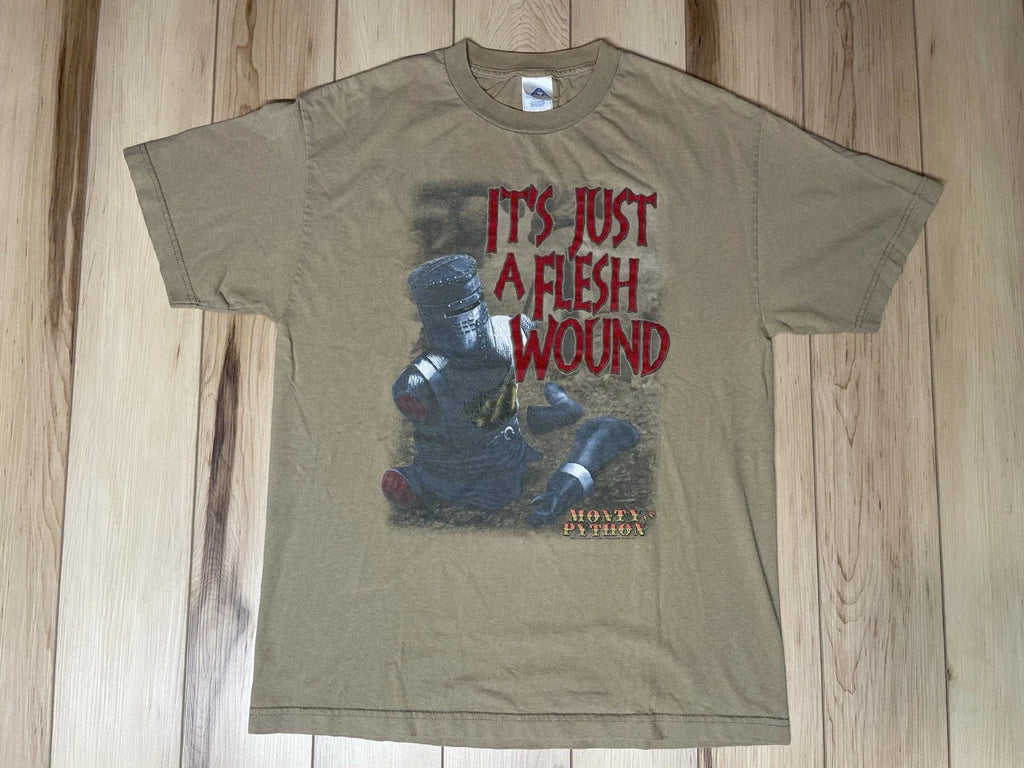 Vtg Y2K 2005 Monty Python Mens Large Distressed It's Just A Flesh Wound T-Shirt Unisex T-shirt, Sweatshirt, Hoodie, Long Sleeve Tee - T-Shirt, Sweatshirt, Hoodie
